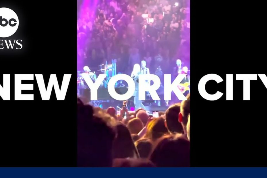 Billy Joel performs 'Uptown Girl' while Christie Brinkley is seen in audience
