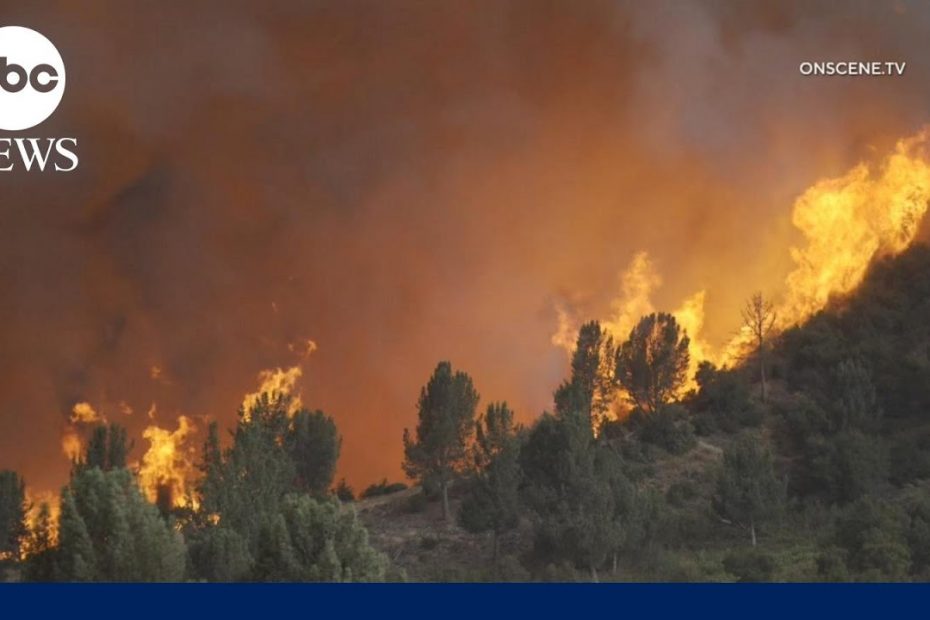 Thousands of buildings threatened by California wildfires as evacuations continue